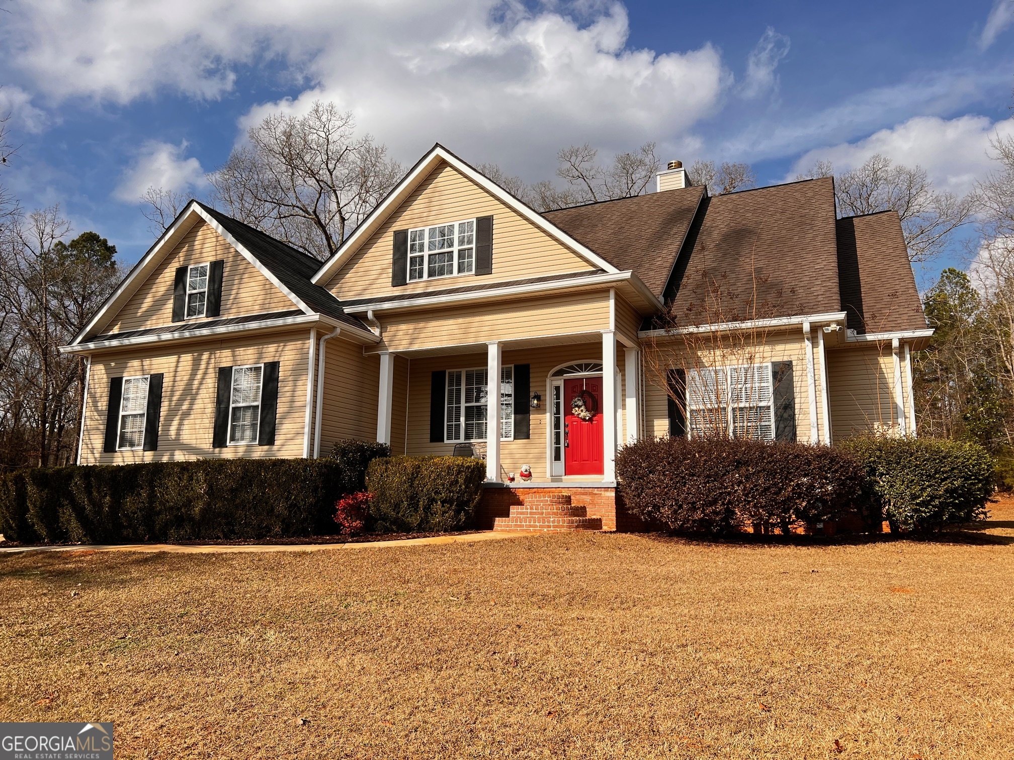 a front view of a house with a yard