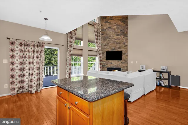 a kitchen with a center island and a stove top oven