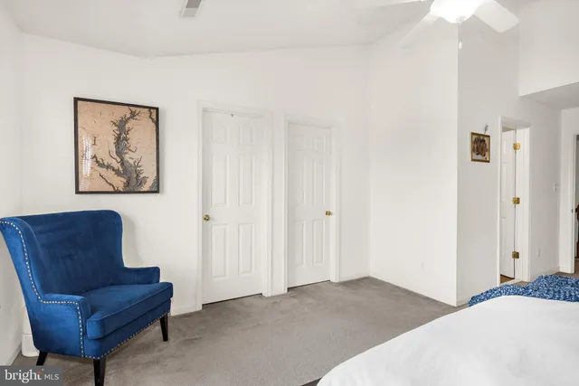 a bedroom with a bed and a couch