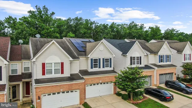 a aerial view of a house with balcony and garden