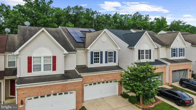 a aerial view of a house with a yard