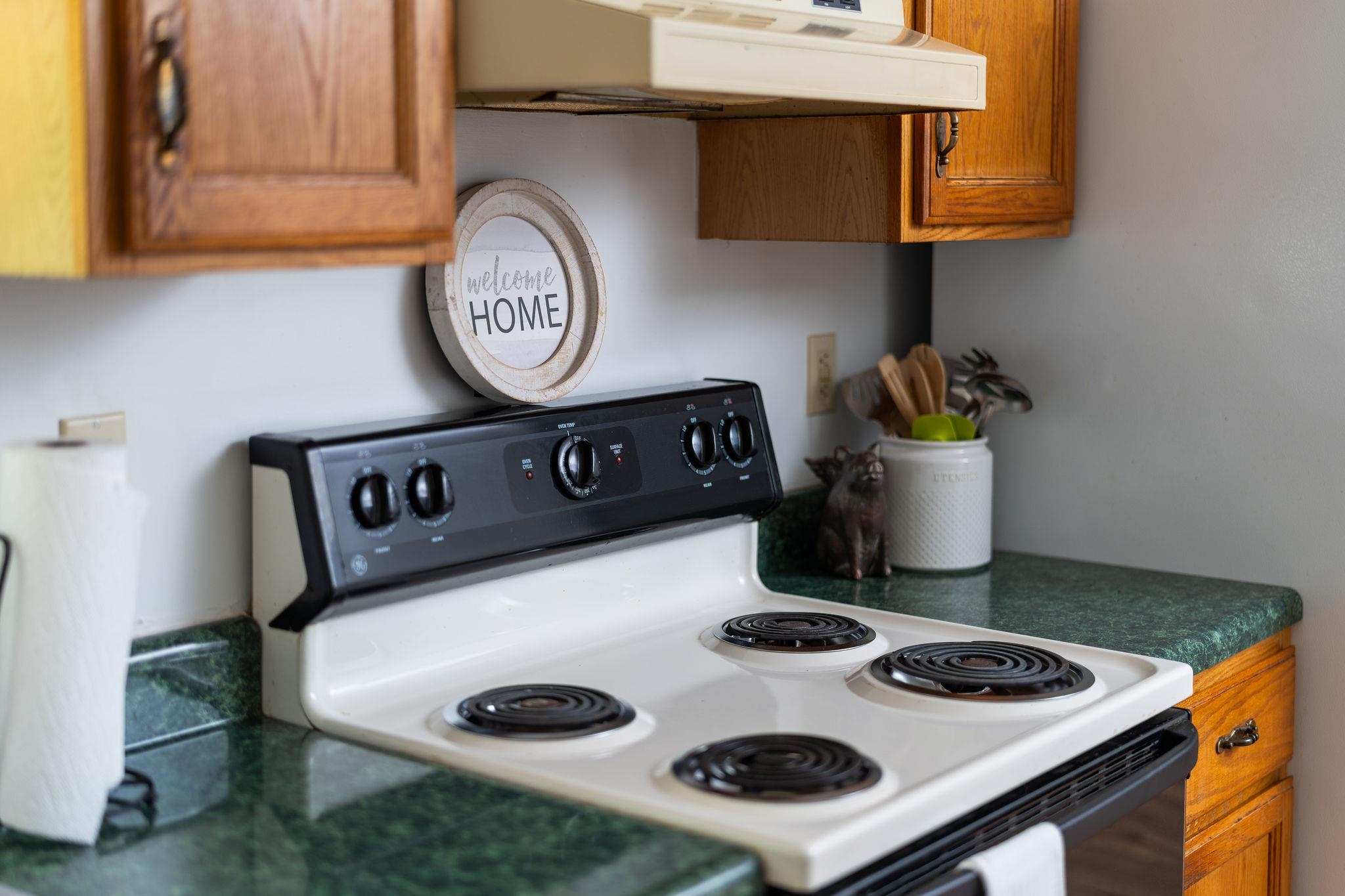 87 Swisher Road Staunton, VA 24401 - Photo 30 of 75 a kitchen with a stove and a clock