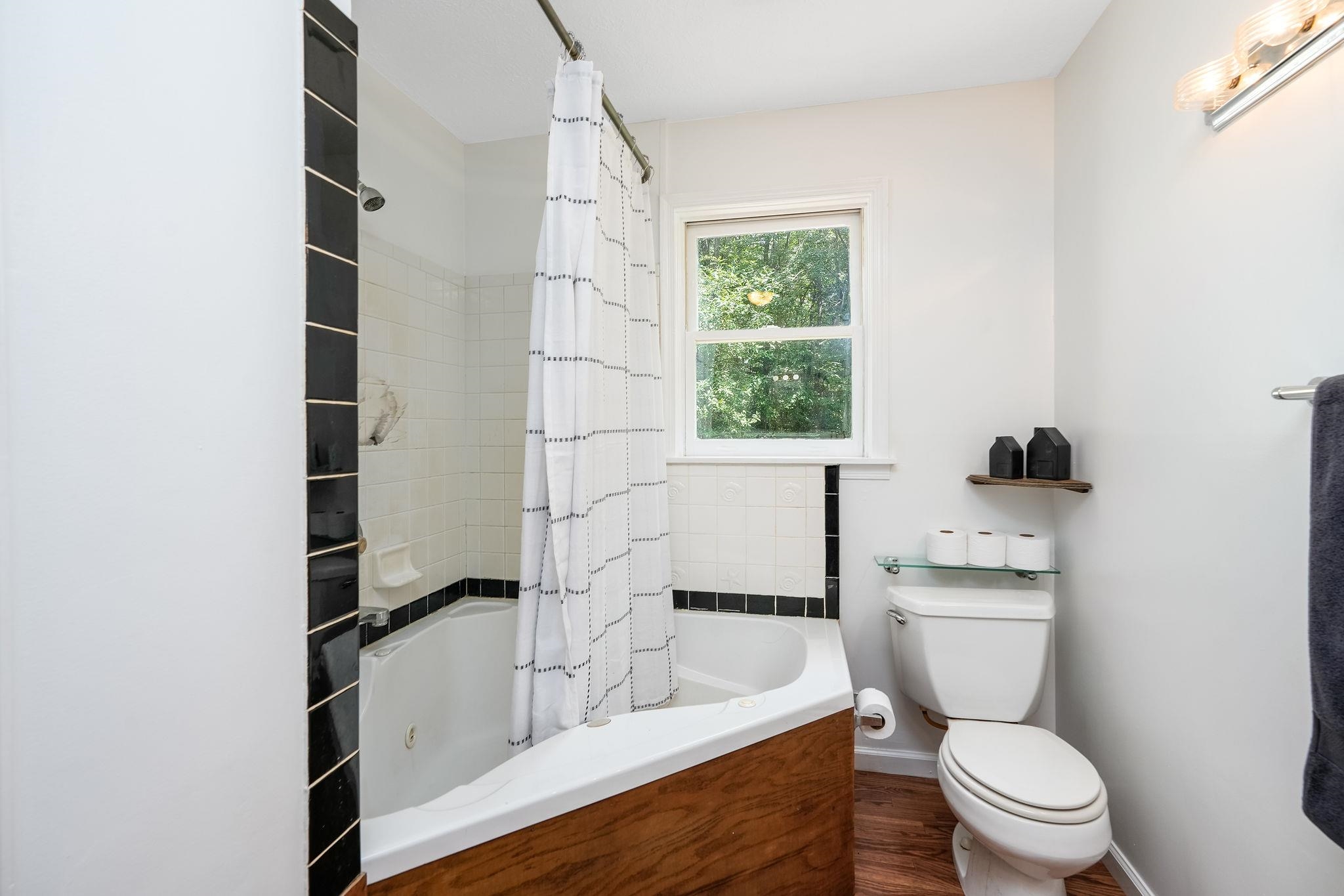 87 Swisher Road Staunton, VA 24401 - Photo 39 of 75 a bathroom with a toilet a sink and a window