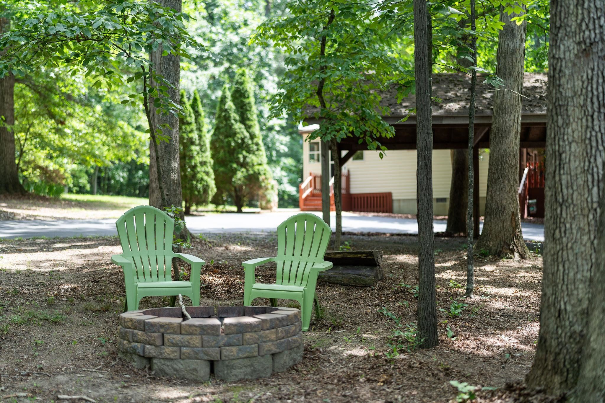 87 Swisher Road Staunton, VA 24401 - Photo 71 of 75 a view of a patio with table and chairs potted plants and large tree