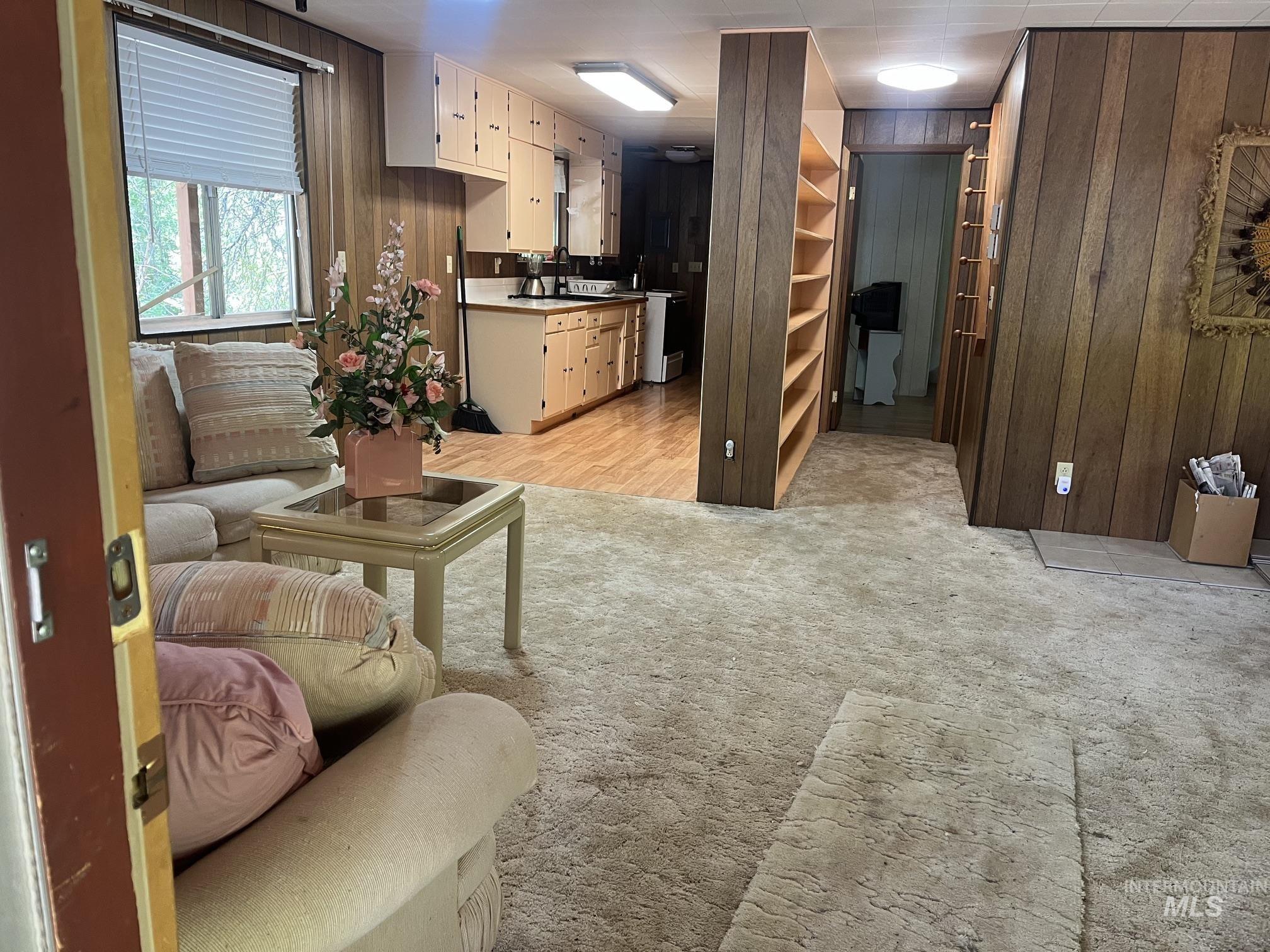 39 Mayflower Mine Road Placerville, ID 83666 - Photo 14 of 36 Room featuring wood-finish paneling and carpeted flooring