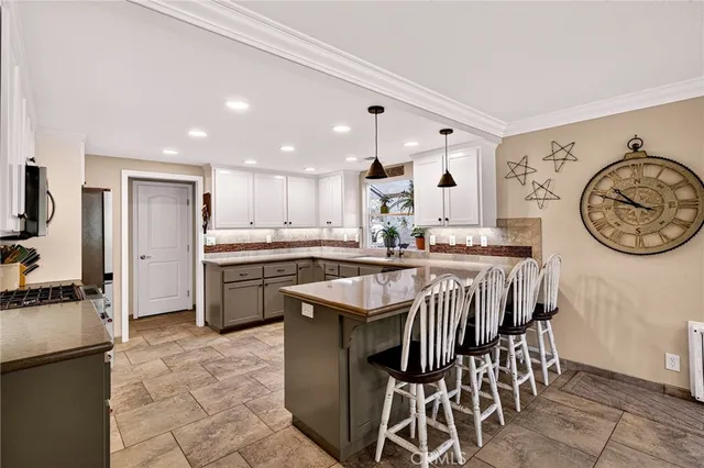 a bathroom with a granite countertop double vanity sinks and a mirror