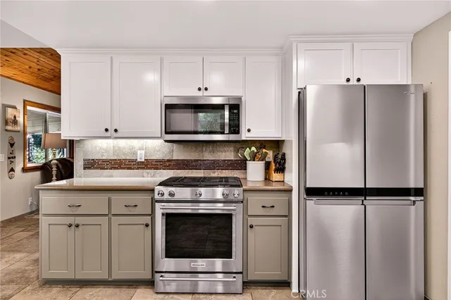 a bedroom with bed and a chandelier