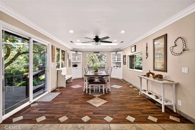 a bedroom with a bed desk and a window