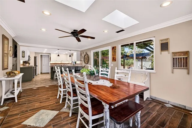 a bathroom with a granite countertop toilet sink and mirror