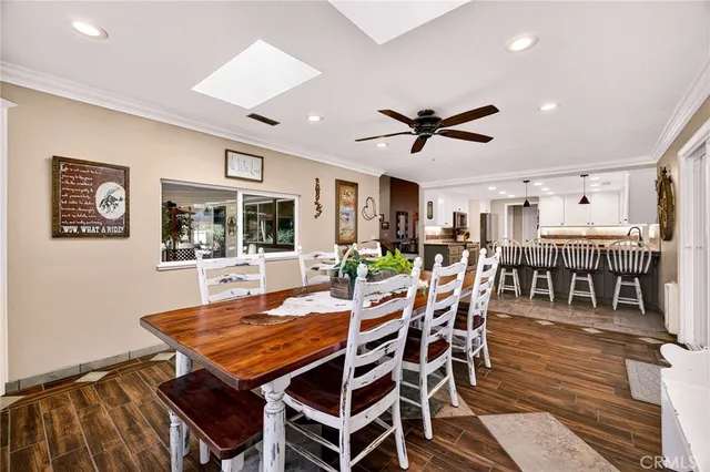a bed room with a bed and a ceiling fan