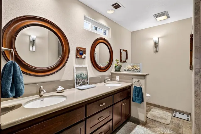 a view of house with swimming pool and sitting area