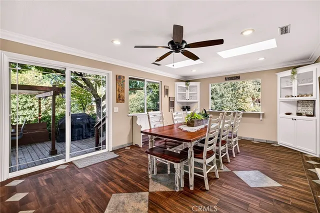 a view of a swimming pool with chairs in patio