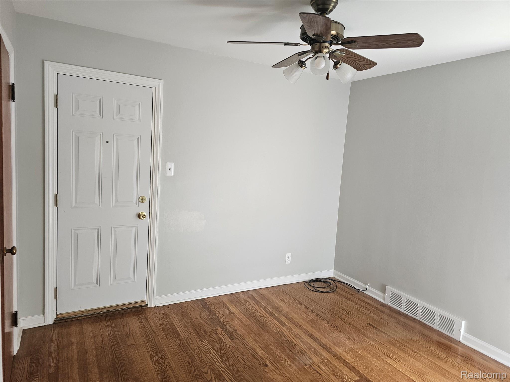 5240 Harvard Road Detroit, MI 48224 - Photo 13 of 18 Hardwood-finish flooring throughout, complemented by light gray wall tones and white baseboards