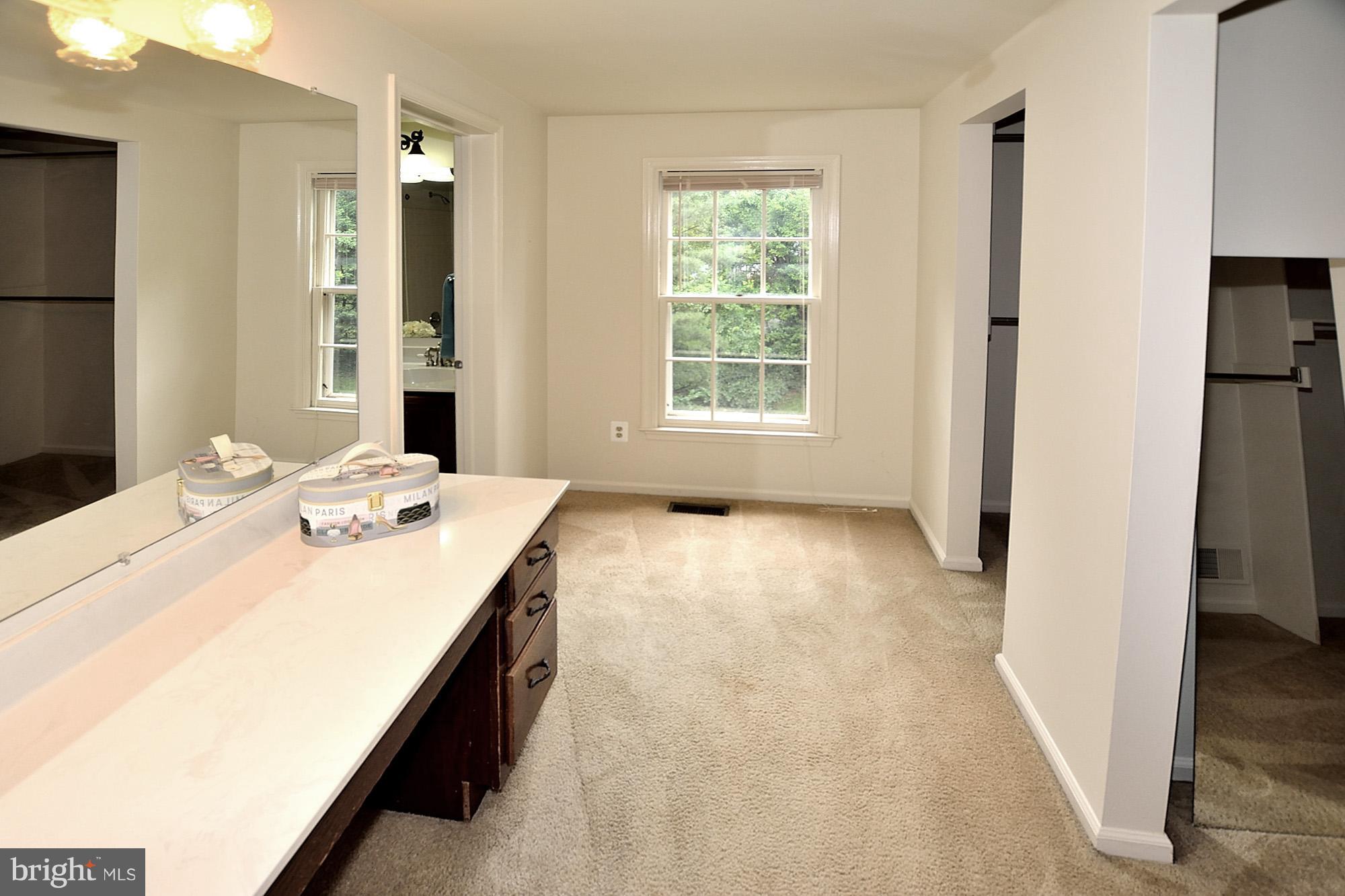 103 Minor Road Sterling, VA 20165 - Photo 18 of 30 Master bedroom vanity area with 2 walk in closets