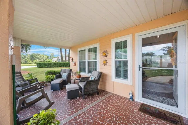 a balcony with furniture and garden