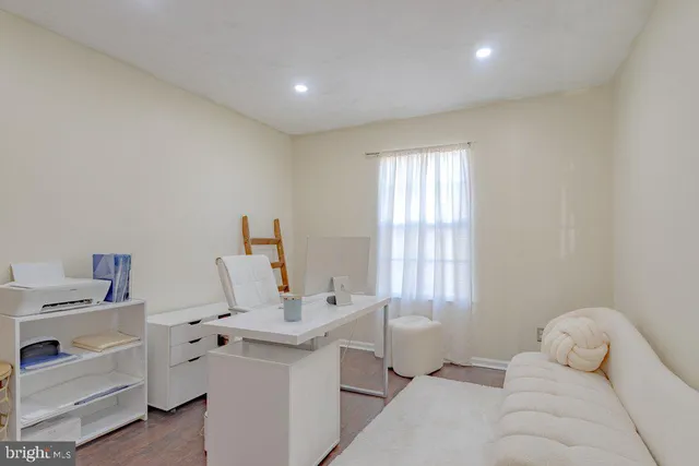 a bedroom with a large bed and a couch