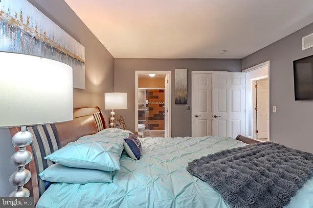 a roof deck with couches and wooden floor