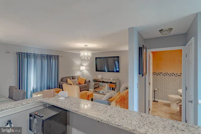 a kitchen with stainless steel appliances granite countertop a refrigerator sink and stove