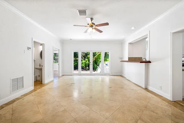 a view of a kitchen with a sink and a window