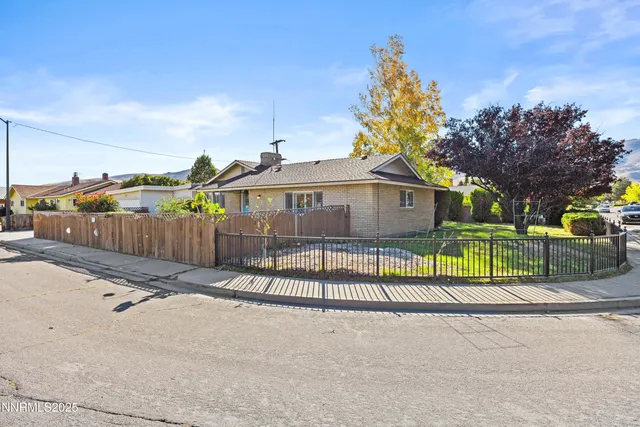 a view of a house next to a yard