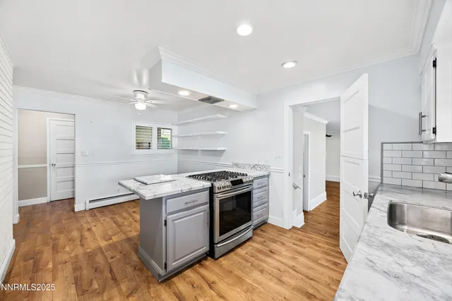 a kitchen with a stove and a refrigerator