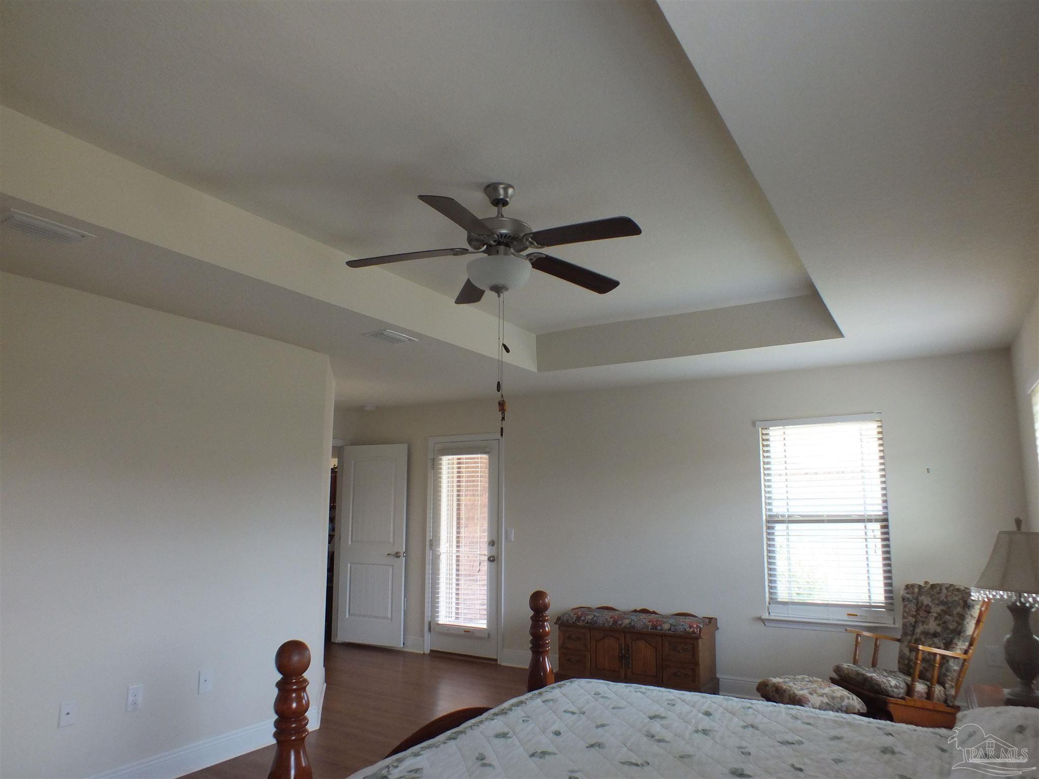 4441 Fiske Street Pace, FL 32571 - Photo 15 of 16 a living room with furniture window and a ceiling fan
