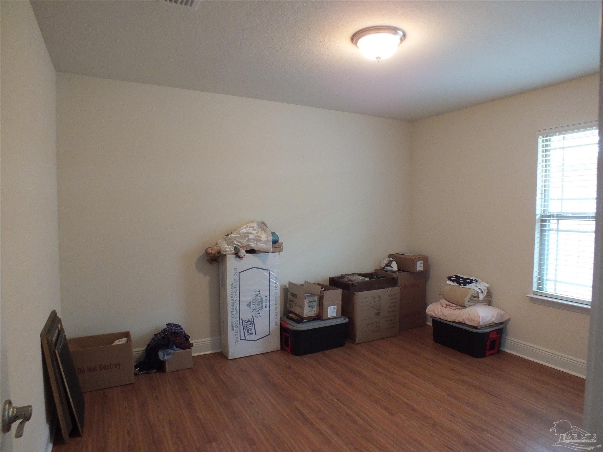 4441 Fiske Street Pace, FL 32571 - Photo 10 of 16 a living room with furniture and a window