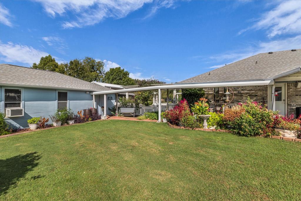 107 Fort Graham Circle Waco, TX 76705 - Photo 27 of 39 Covered Walkway with flower garden