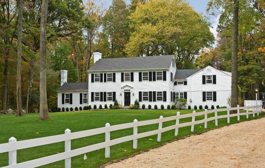 75 Pembroke Road Darien, CT 06820 - Photo 1 of 35 a front view of a house with a yard