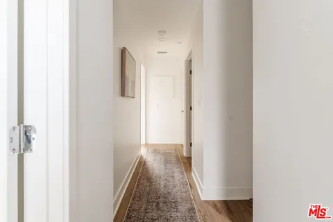 a view of a hallway with white walls