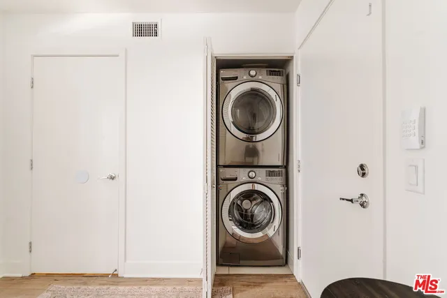 a view of a hallway with washer and dryer