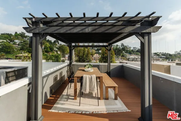a view of a porch with furniture and yard