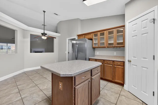a view of an empty room with a fan