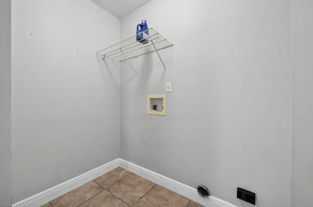 a view of an empty room with a ceiling fan