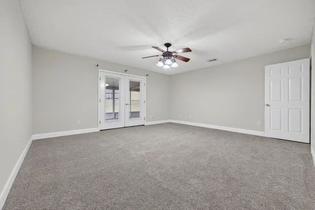 a bathroom with a tub shower and vanity