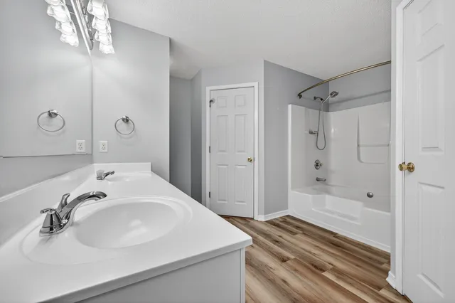 a bathroom with a sink vanity and a mirror