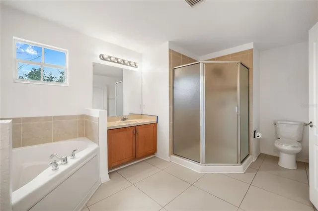 a bathroom with a tub toilet and sink