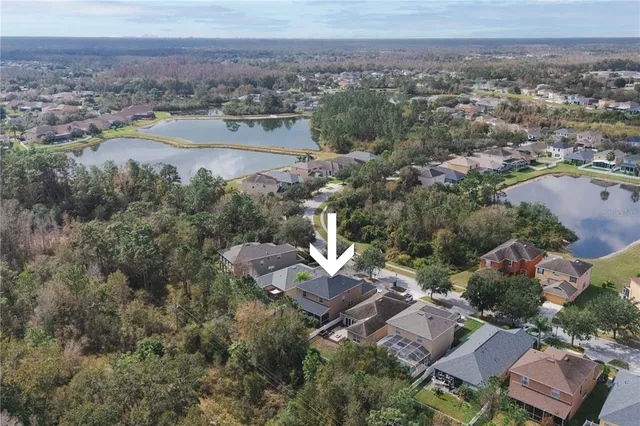 an aerial view of a city and lake view
