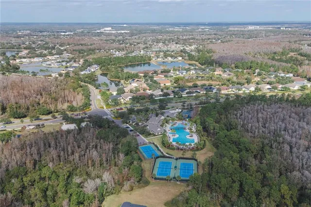 an aerial view of a house with outdoor space