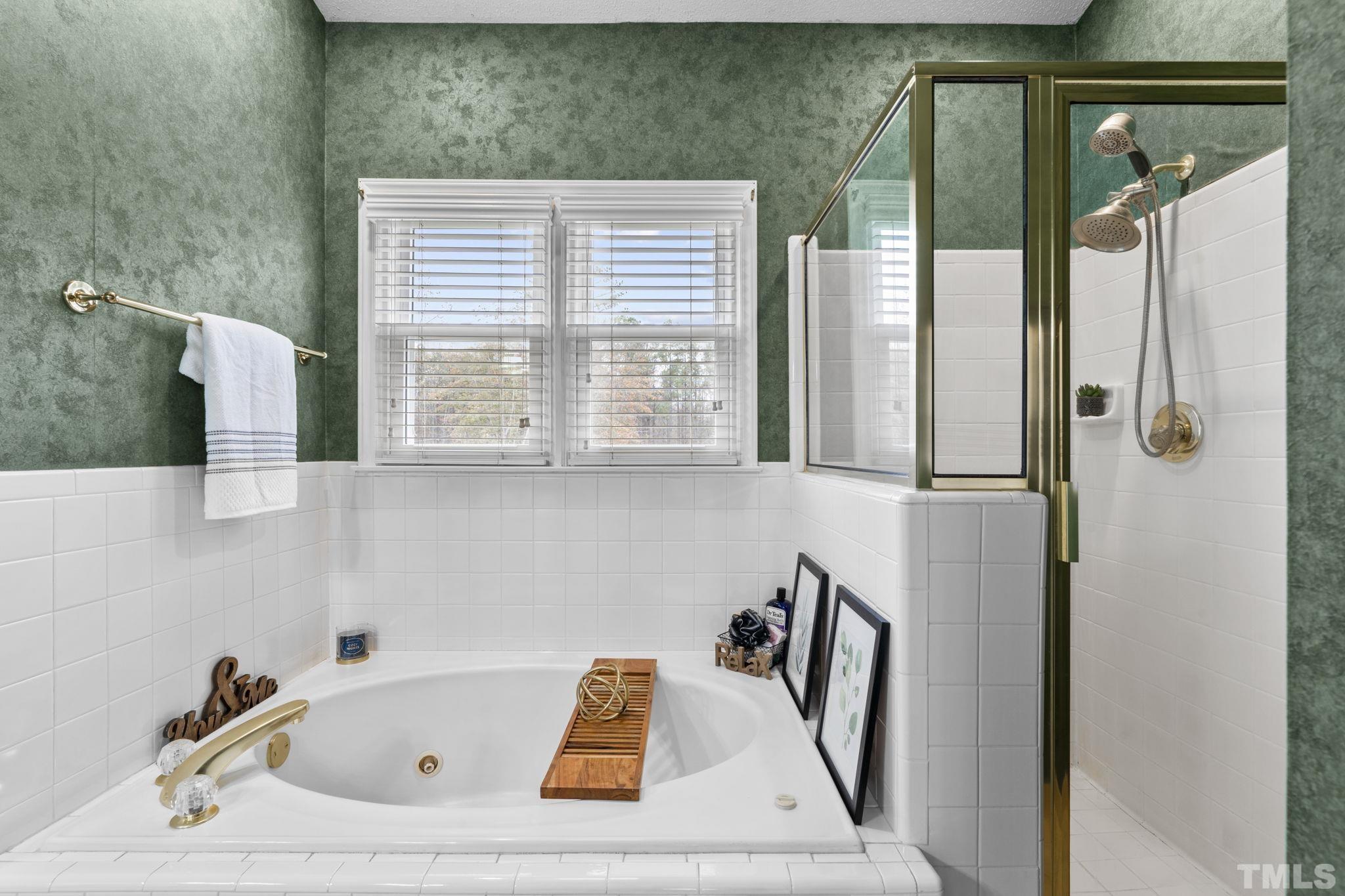 1101 Sky Point Court Raleigh, NC 27603 - Photo 26 of 52 a bathroom with a bathtub and a sink