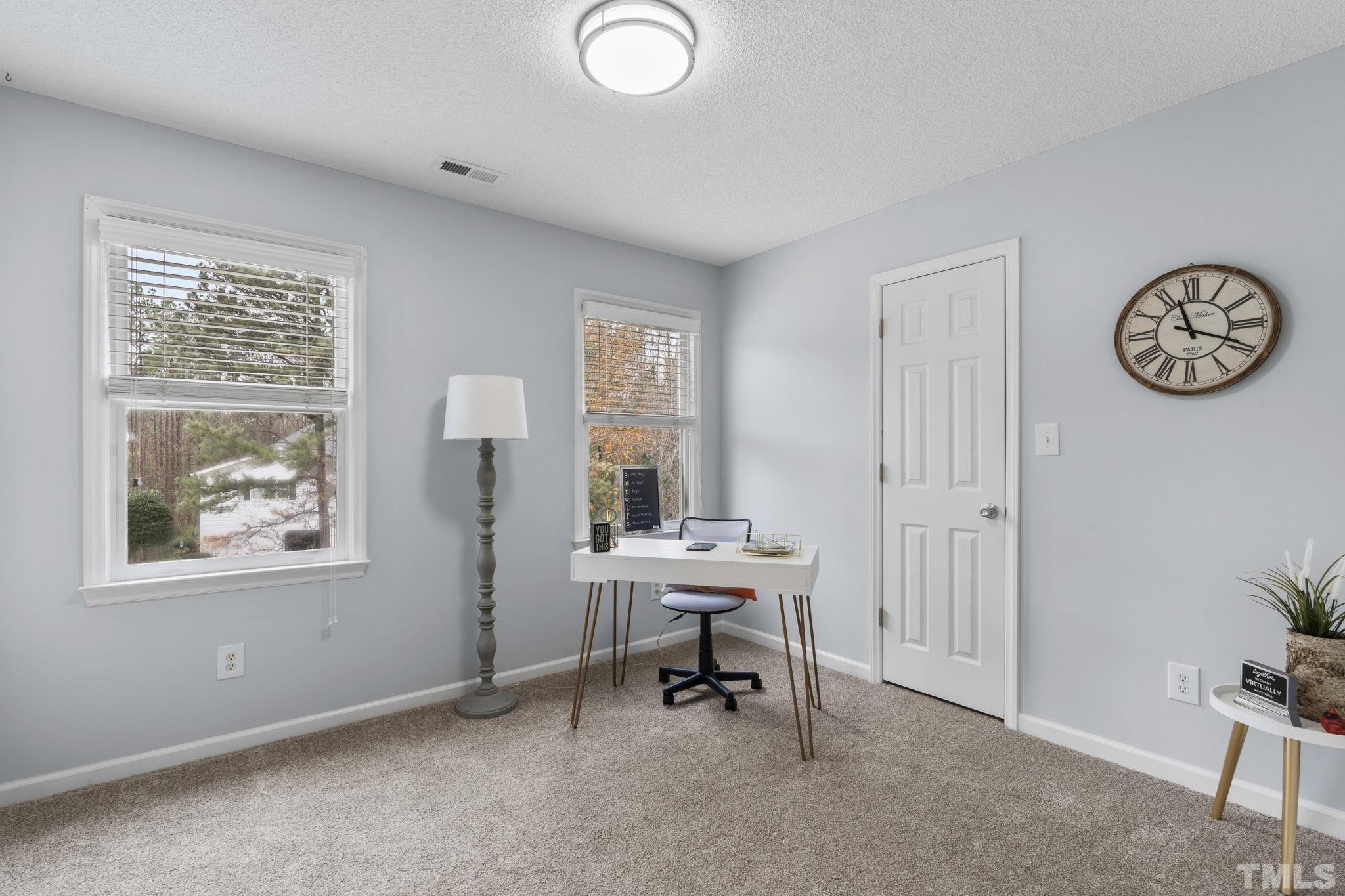 1101 Sky Point Court Raleigh, NC 27603 - Photo 31 of 52 a view of a workspace with furniture and a window