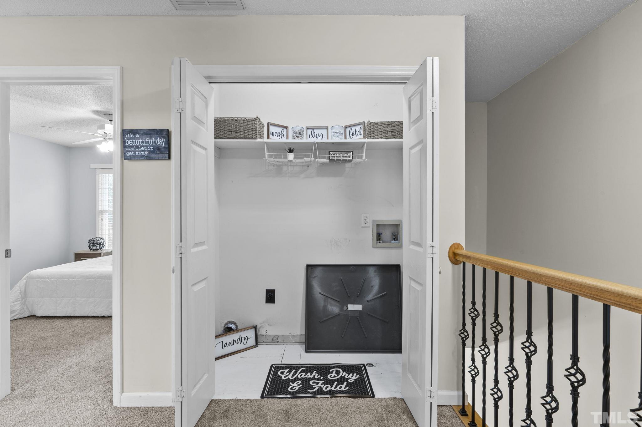 1101 Sky Point Court Raleigh, NC 27603 - Photo 32 of 52 a walk in closet with a wooden floor