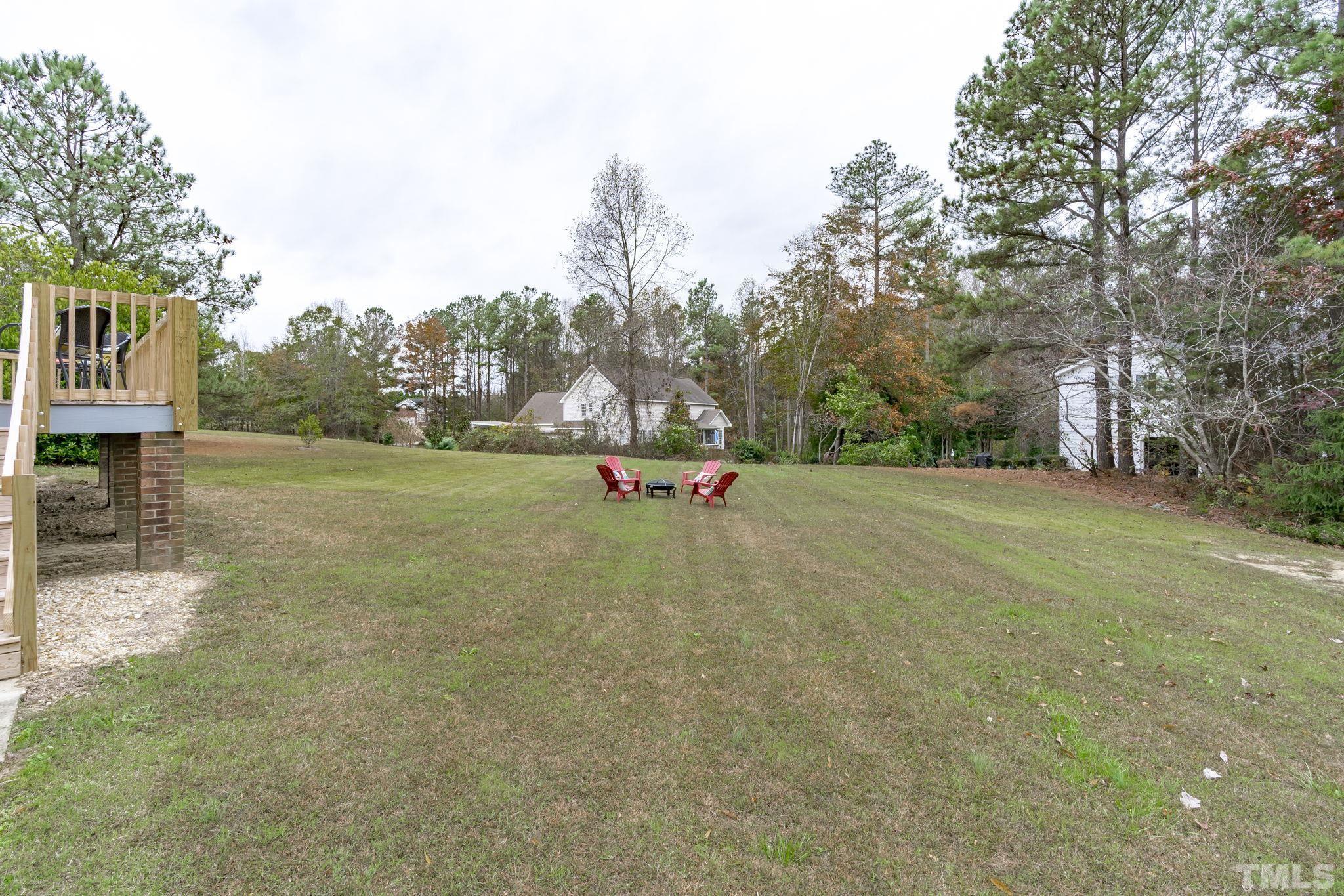 1101 Sky Point Court Raleigh, NC 27603 - Photo 36 of 52 a small garden covered with tall trees