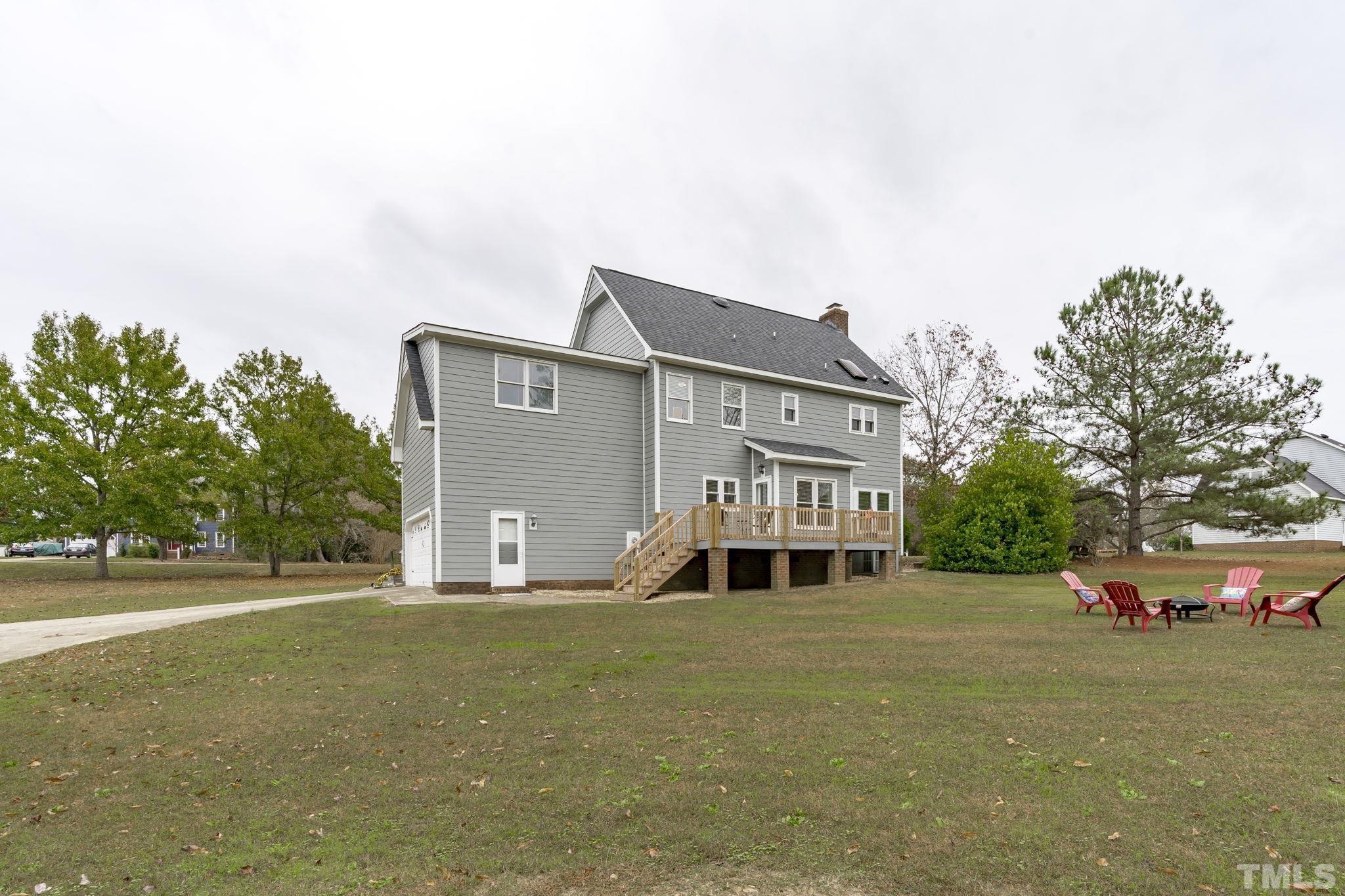 1101 Sky Point Court Raleigh, NC 27603 - Photo 38 of 52 a front view of a house with a yard