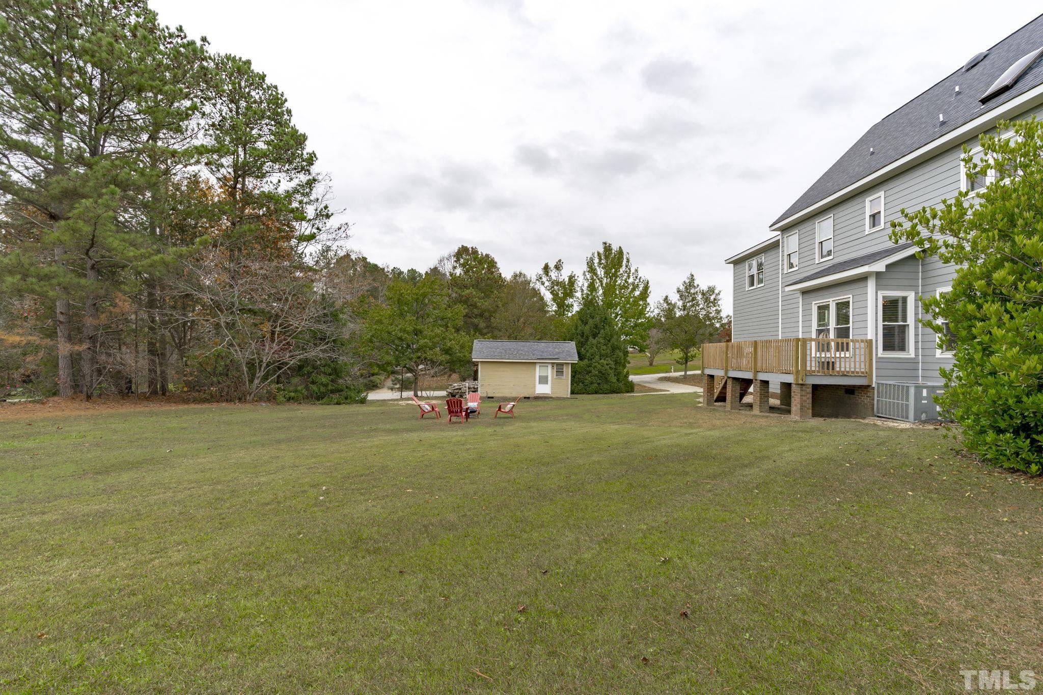 1101 Sky Point Court Raleigh, NC 27603 - Photo 45 of 52 a house with trees in front of it