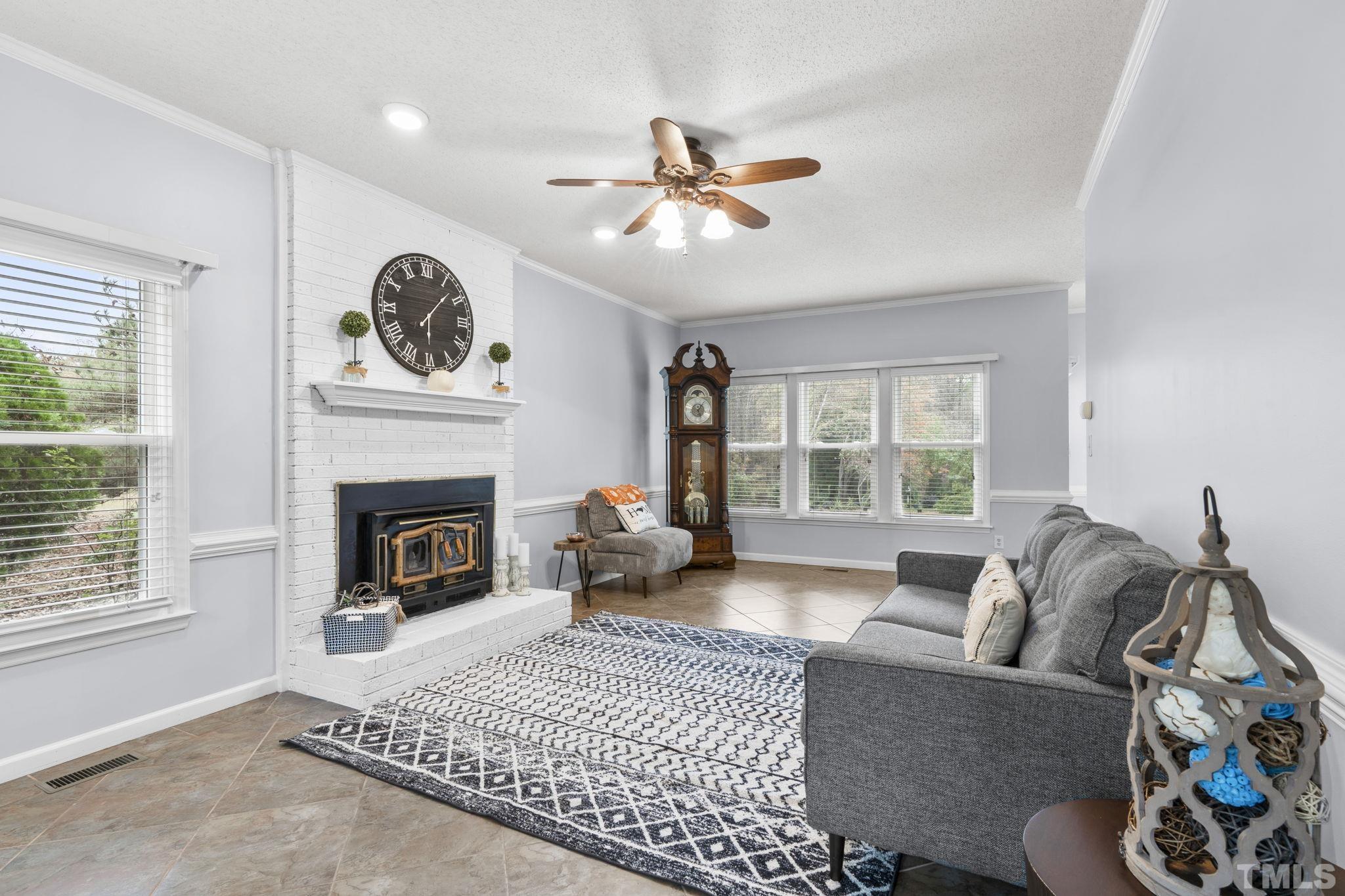 1101 Sky Point Court Raleigh, NC 27603 - Photo 6 of 52 a living room with furniture and a fireplace