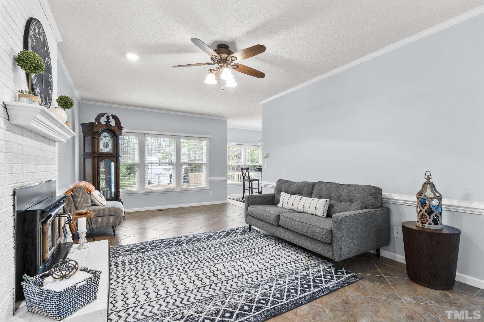 1101 Sky Point Court Raleigh, NC 27603 - Photo 7 of 52 a living room with furniture and a large window