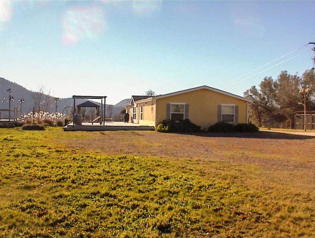 39950 Millwood Road Dunlap, CA 93621 - Photo 41 of 64 a view of a house with a yard