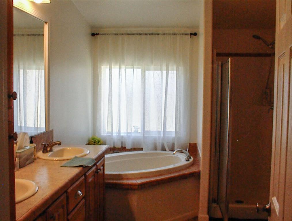 39950 Millwood Road Dunlap, CA 93621 - Photo 60 of 64 a bathroom with a granite countertop sink and a mirror
