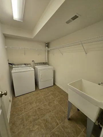 a utility room with dryer and washer
